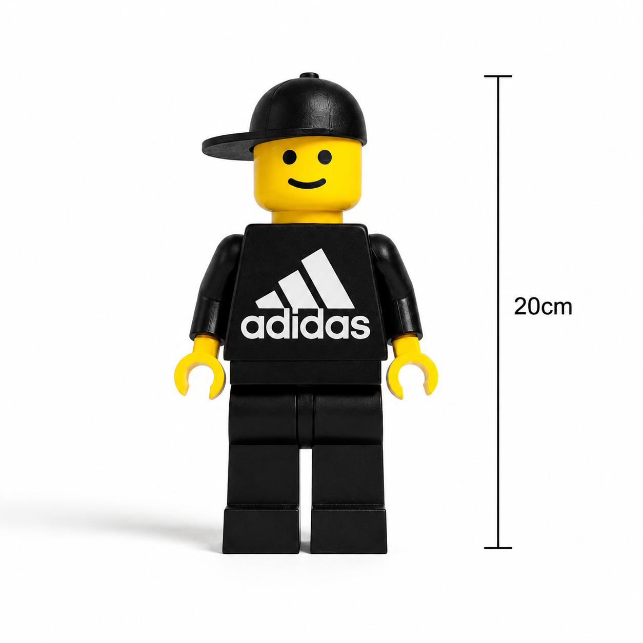 LEGO minifigure wearing an Adidas shirt with a measurement label on a white background
