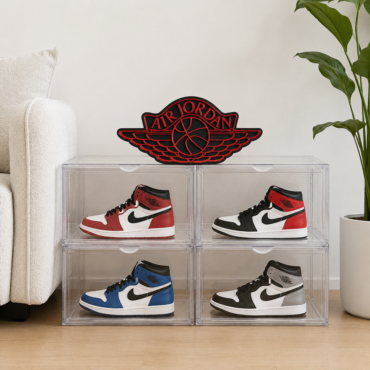 Four pairs of Air Jordan sneakers in clear acrylic display cases with a red logo in the background.