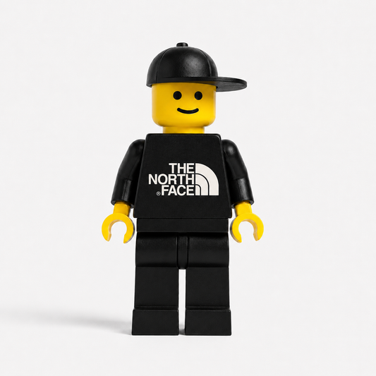 LEGO minifigure wearing a black shirt with 'The North Face' logo on a white background